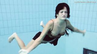 Gypsy african haired beauty swimming underwater