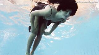 Gypsy african haired beauty swimming underwater