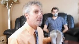Professor Richard Lennox tickles the feet of his young student Kody Tracer.