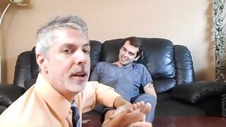 Professor Richard Lennox tickles the feet of his young student Kody Tracer.