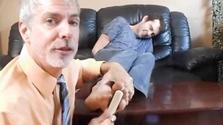 Professor Richard Lennox tickles the feet of his young student Kody Tracer.