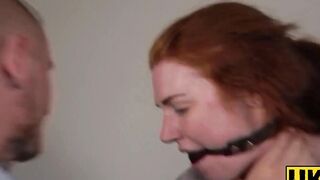 "Redheaded Slave Girl Endures Rough Bondage Session With Dominant Master"