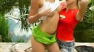 Girl-on-girl intimacy at lake with sensual kissing, passionate sex, orgasmic bliss, lesbian lovers sharing intimate moments