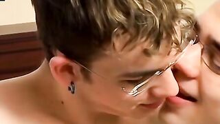 Attractive twink with glasses swallows a massive cock