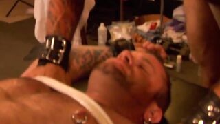 Muscular hunk endures bondage with pins in his chest