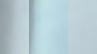 Asian woman gropes her tits and fingers her cunt like a man would