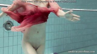 Katya Okuneva gets naked into her red panties underwater