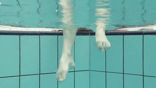 Katya Okuneva gets naked into her red panties underwater
