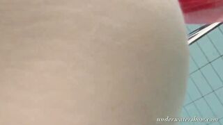 Katya Okuneva gets naked into her red panties underwater