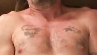 Beefy tatted mature gay shows off wanking skills