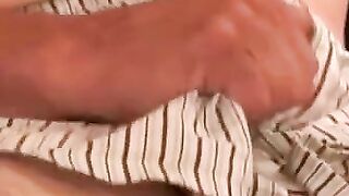 Naughty grandpa strokes his cock while watching porn
