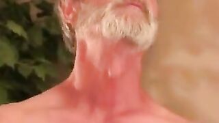 Naughty grandpa strokes his cock while watching porn