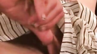 Naughty grandpa strokes his cock while watching porn
