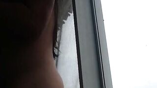 Exhibitionist Petite Masturbates Near Open Window on Webcam