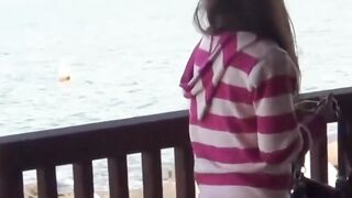 Sweet Asian girl roped to fence desperate to release bladder