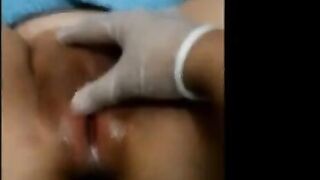 Asian girl spreads and fingers herself on webcam.