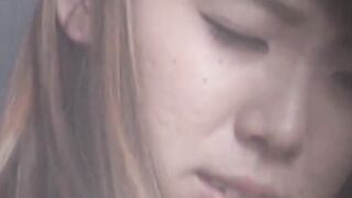 Dark haired Japanese vixen digs fingers to beat boredom solo