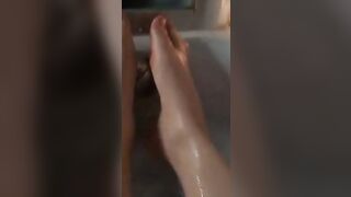 BBW splashes her adorable foot into the bathtub.