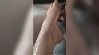 BBW splashes her adorable foot into the bathtub.