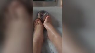 BBW splashes her adorable foot into the bathtub.