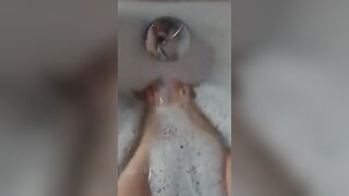 BBW splashes her adorable foot into the bathtub.