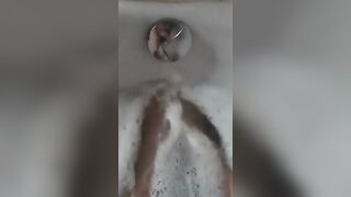 BBW splashes her adorable foot into the bathtub.