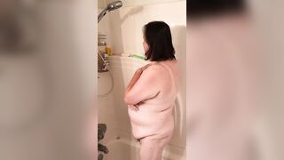 Naomi takes a shower