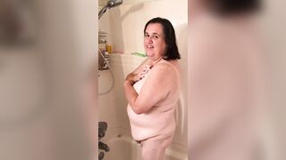 Naomi takes a shower