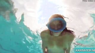 Hottie Candy swims and gets naked naked underwater