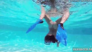 Hottie Candy swims and gets naked naked underwater