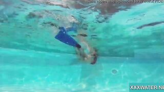 Hottie Candy swims and gets naked naked underwater