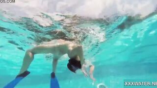 Hottie Candy swims and gets naked naked underwater