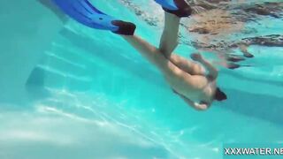 Hottie Candy swims and gets naked naked underwater
