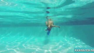 Hottie Candy swims and gets naked naked underwater
