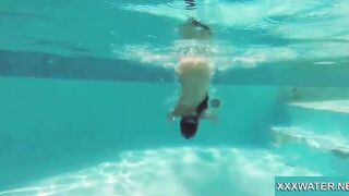 Hottie Candy swims and gets naked naked underwater