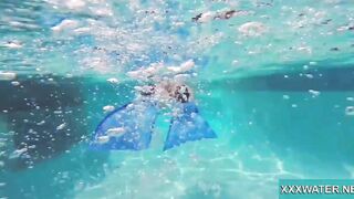 Hottie Candy swims and gets naked naked underwater