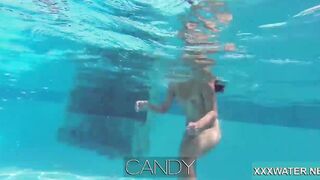 Hottie Candy swims and gets naked naked underwater