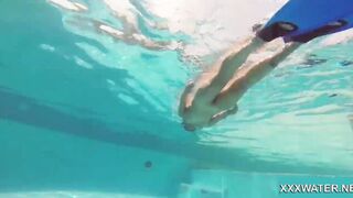 Hottie Candy swims and gets naked naked underwater