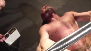 Master Chad Brock writhes under the electro pad torment