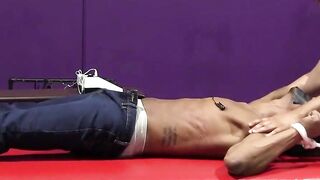 Kaden Roads slaps captive with flogger then plays with cock
