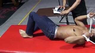 Kaden Roads slaps captive with flogger then plays with cock