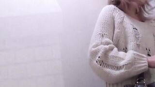 Peeping lens films girls urinating in open public toilets
