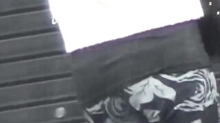 Peeping lens films girls urinating in open public toilets