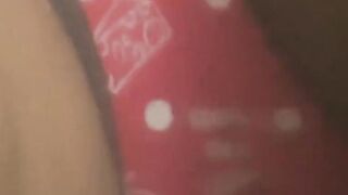 Oriental babe in red panties drills pussy in a solo act