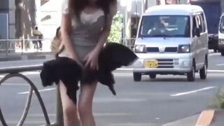 Peeping grabs Japanese girls skirt lifted by gusty breeze