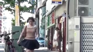 Peeping grabs Japanese girls skirt lifted by gusty breeze