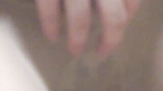 Asian woman gropes tits and finger fucks cunt like a man
