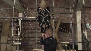Bound slave edged painfully by master's skilled hands