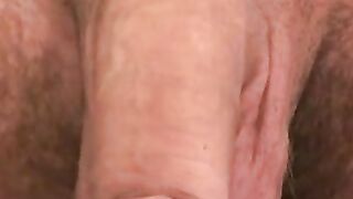 Inked pierced mature jerks and cums on his stomach