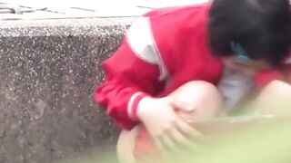 Japanese vixen strokes her bushy slit while outdoor piss
